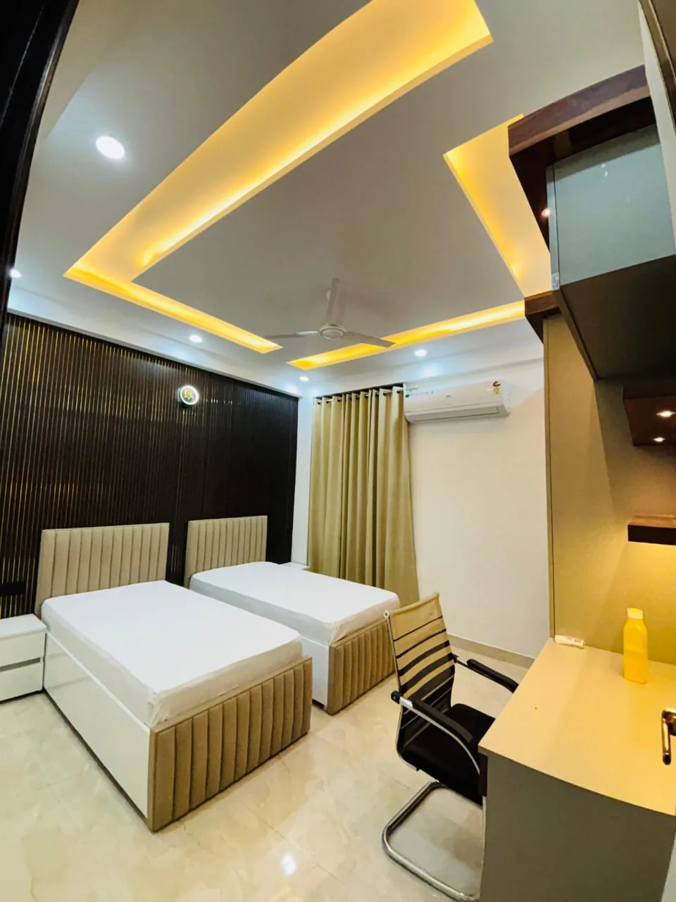 StayHolic furnished bedroom interior suited to an everyday work routine.